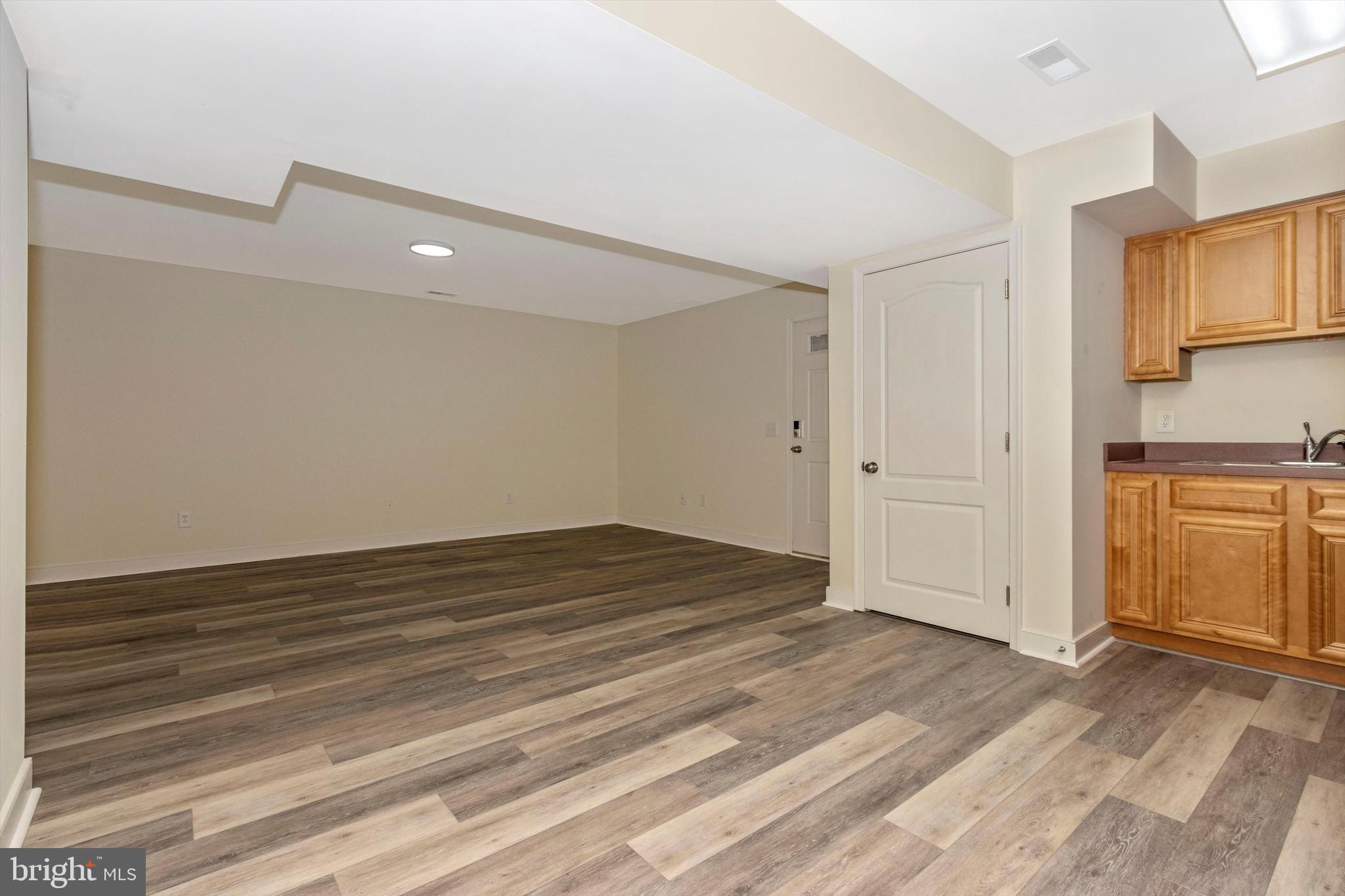 812 Crest Hill Road Severn, MD 21144 - Photo 33 of 55 Large open basement rec room area