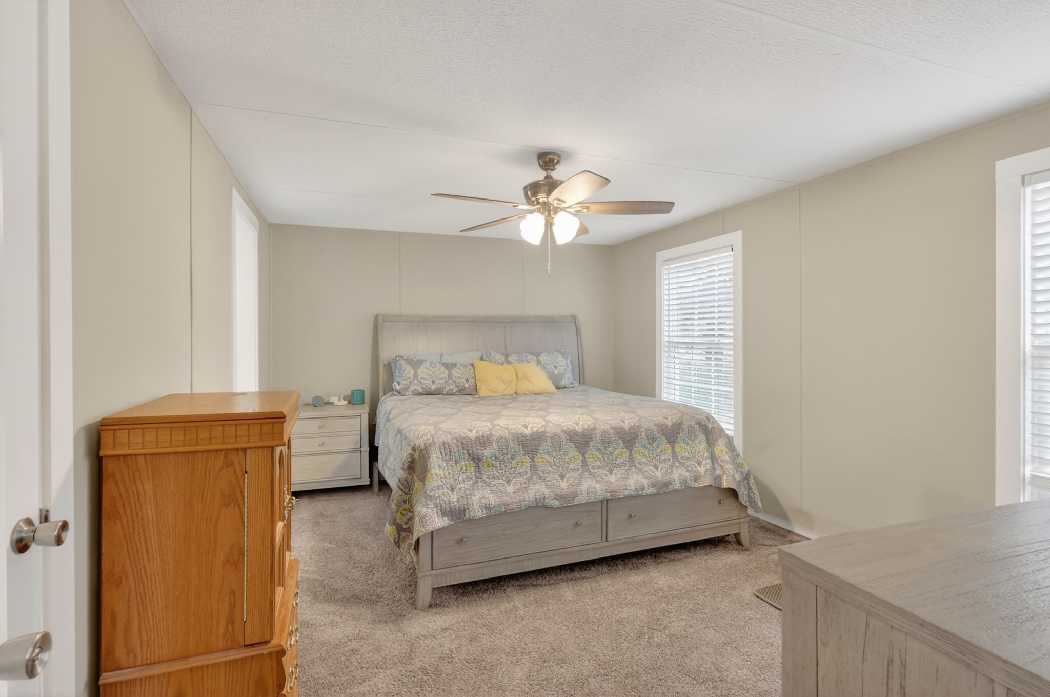 177 Mitchell Road Portland, TN 37148 - Photo 16 of 34 a bedroom with a bed and a chandelier