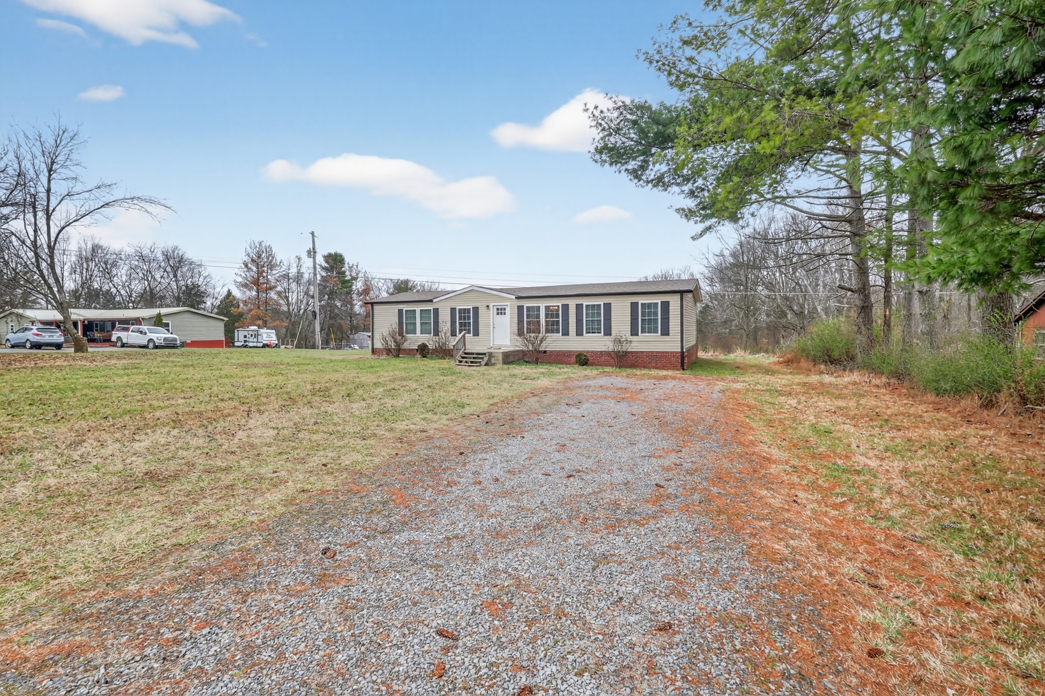 177 Mitchell Road Portland, TN 37148 - Photo 2 of 34 a view of a house with a yard and sitting area