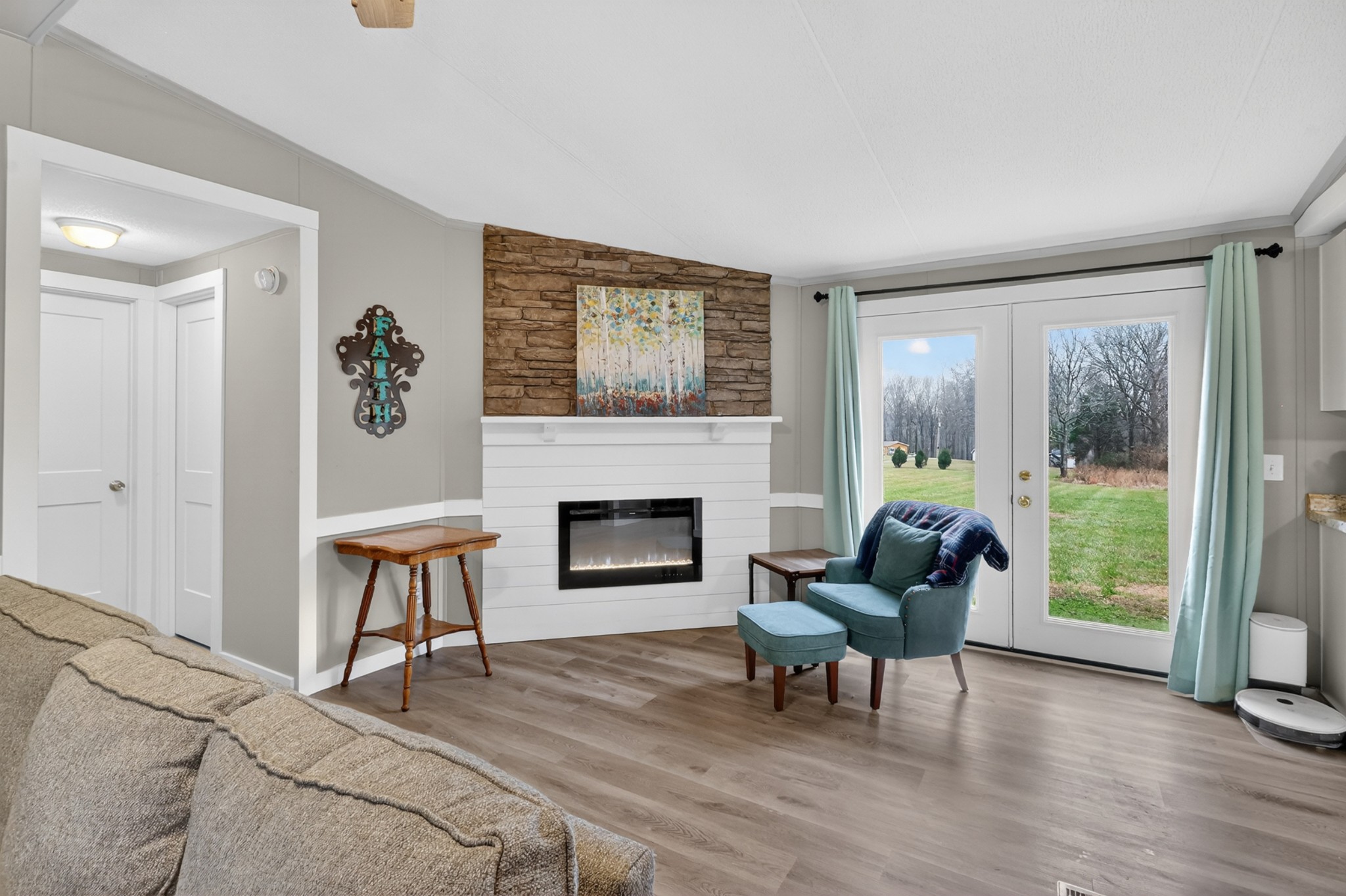 177 Mitchell Road Portland, TN 37148 - Photo 7 of 34 a living room with furniture a fireplace and a table