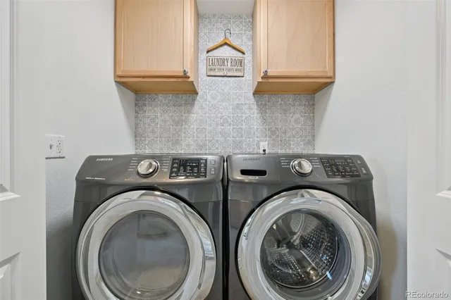 a utility room with dryer and washer