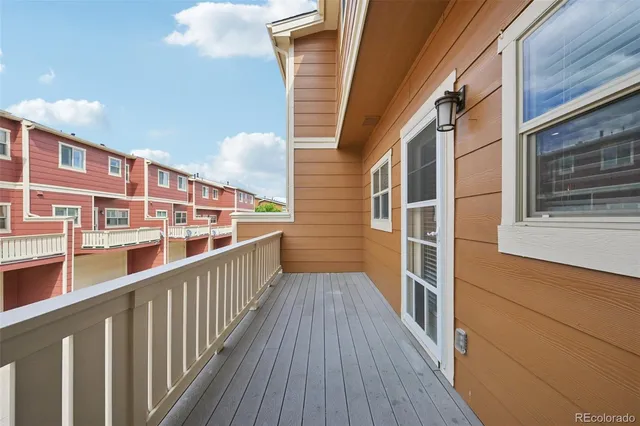 a view of balcony with wooden floor