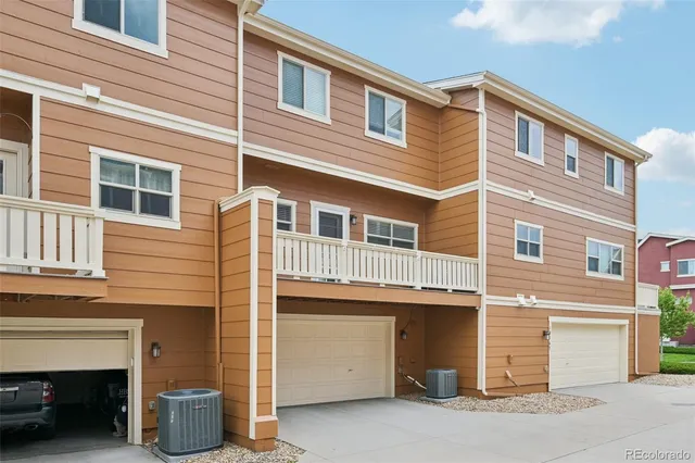 a front view of a building with garage