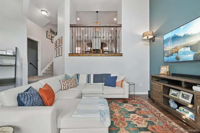 a living room with furniture and a rug