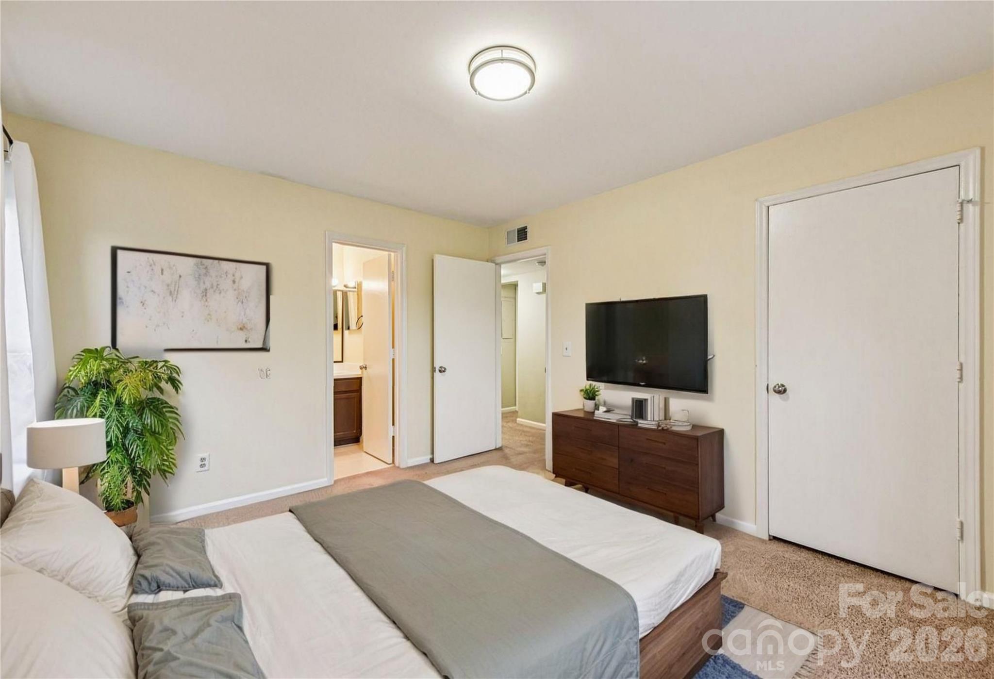 430 Queens Road, Unit 732 Charlotte, NC 28204 - Photo 12 of 17 a living room with furniture and a flat screen tv