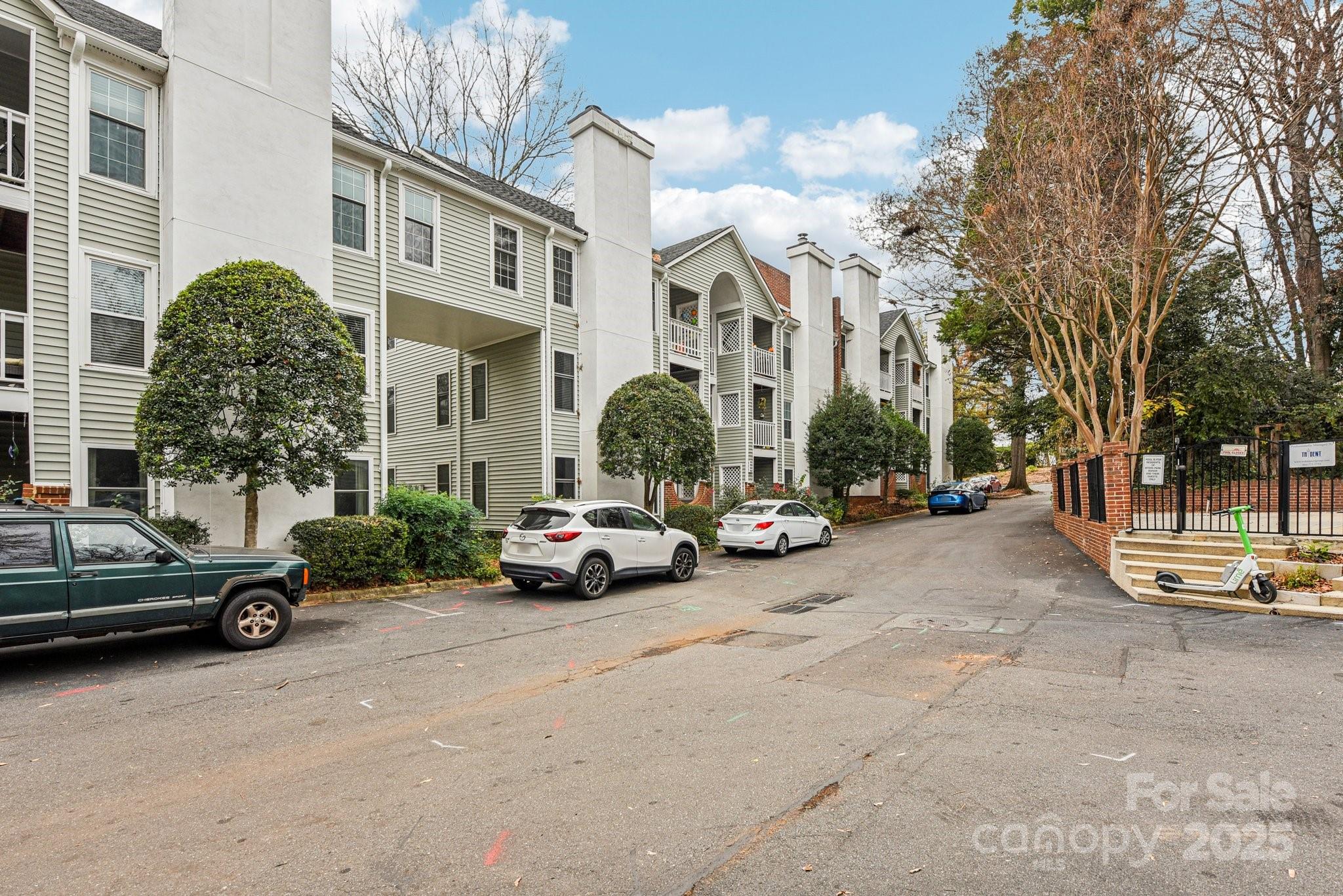 430 Queens Road, Unit 732 Charlotte, NC 28204 - Photo 17 of 17 a view of a cars parked in front of a building