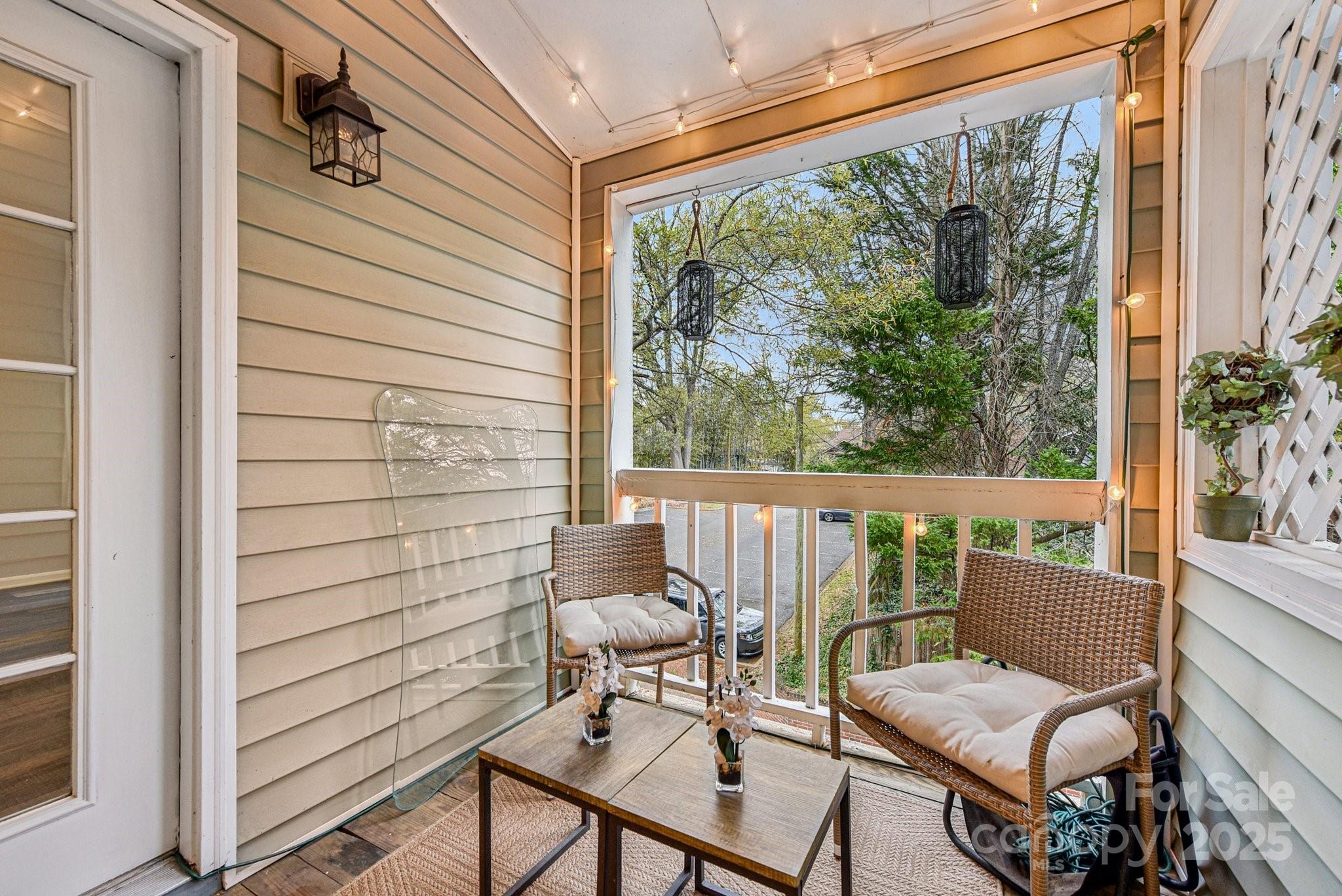 430 Queens Road, Unit 732 Charlotte, NC 28204 - Photo 2 of 17 a view of a chair and table in the balcony