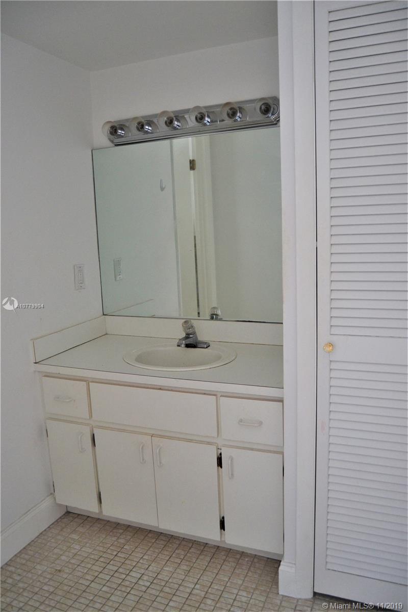 1345 Lincoln Road, Unit 1106 Miami Beach, FL 33139 - Photo 18 of 33 MASTER BATHROOM VANITY AREA WITH LINEN CLOSET PLENTY OF SPACE FOR A LARGE MASTER BEATHROOM SUITE