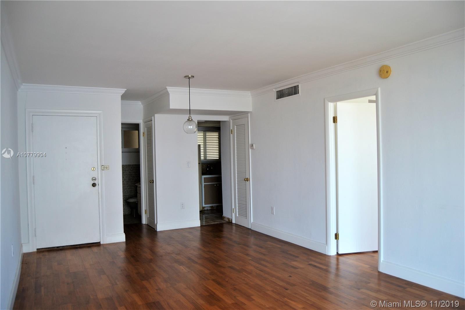 1345 Lincoln Road, Unit 1106 Miami Beach, FL 33139 - Photo 9 of 33 LIVING ROOM WITH CROWN MOLDING