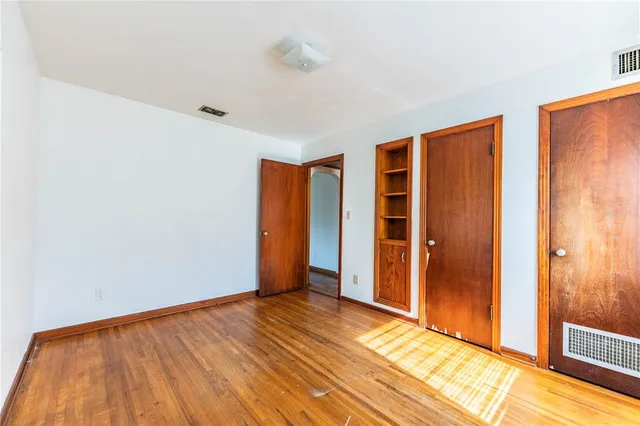 a bathroom with a stove and a toilet