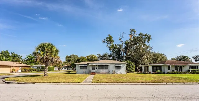 a aerial view of a house with swimming pool