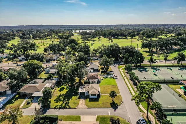 a view of a swimming pool with an outdoor space and seating area