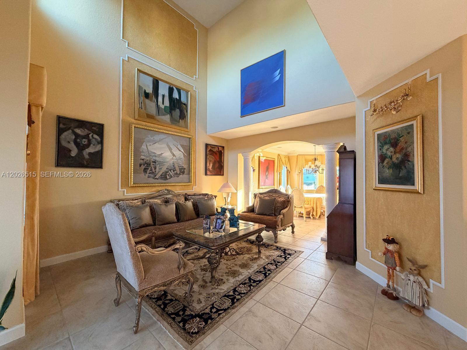 1065 Southwest 150th Place Miami, FL 33194 - Photo 6 of 14 a living room with furniture and a large window