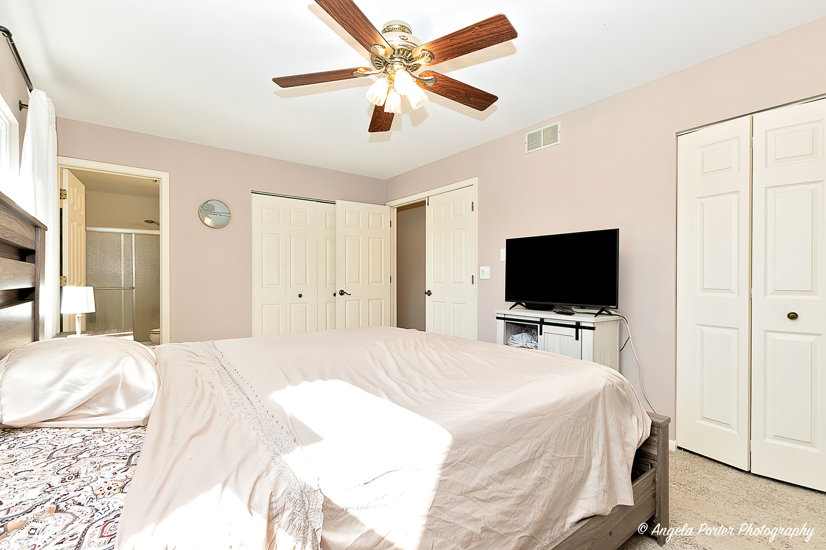 337 Claire Lane Cary, IL 60013 - Photo 23 of 35 a bedroom with a bed and a flat screen tv