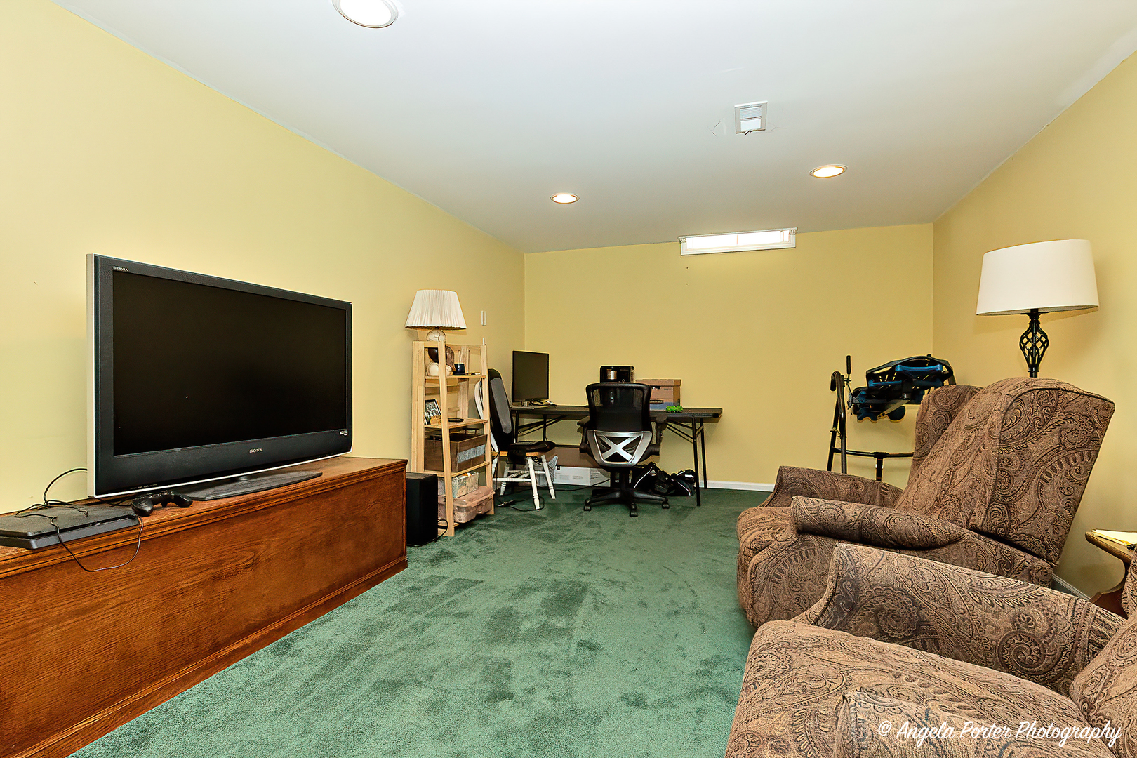 337 Claire Lane Cary, IL 60013 - Photo 25 of 35 a living room with furniture and a flat screen tv