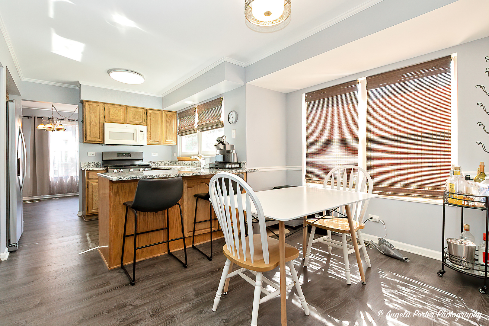 337 Claire Lane Cary, IL 60013 - Photo 3 of 35 a view of a dining room with furniture and wooden floor