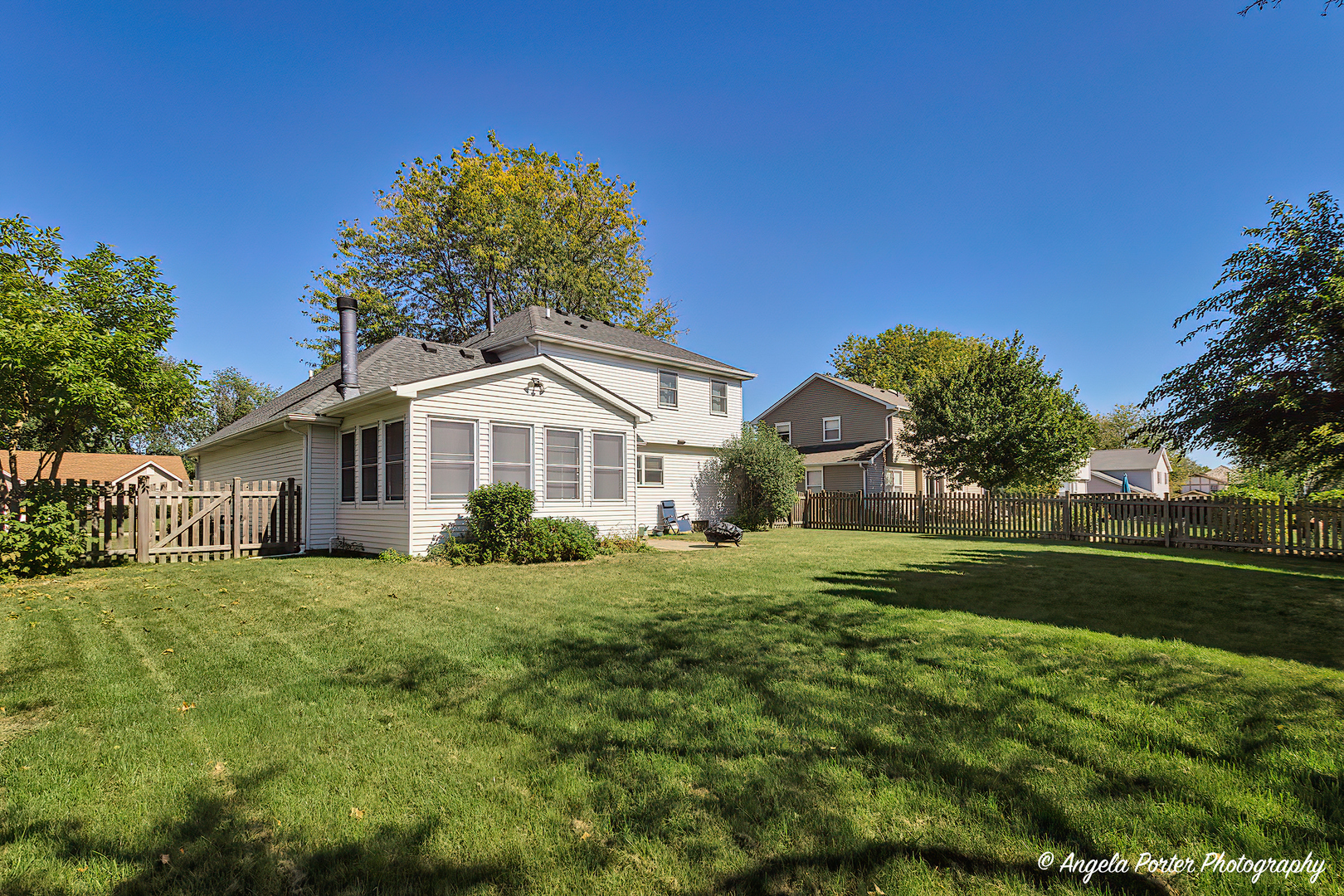 337 Claire Lane Cary, IL 60013 - Photo 33 of 35 a front view of a house with a yard
