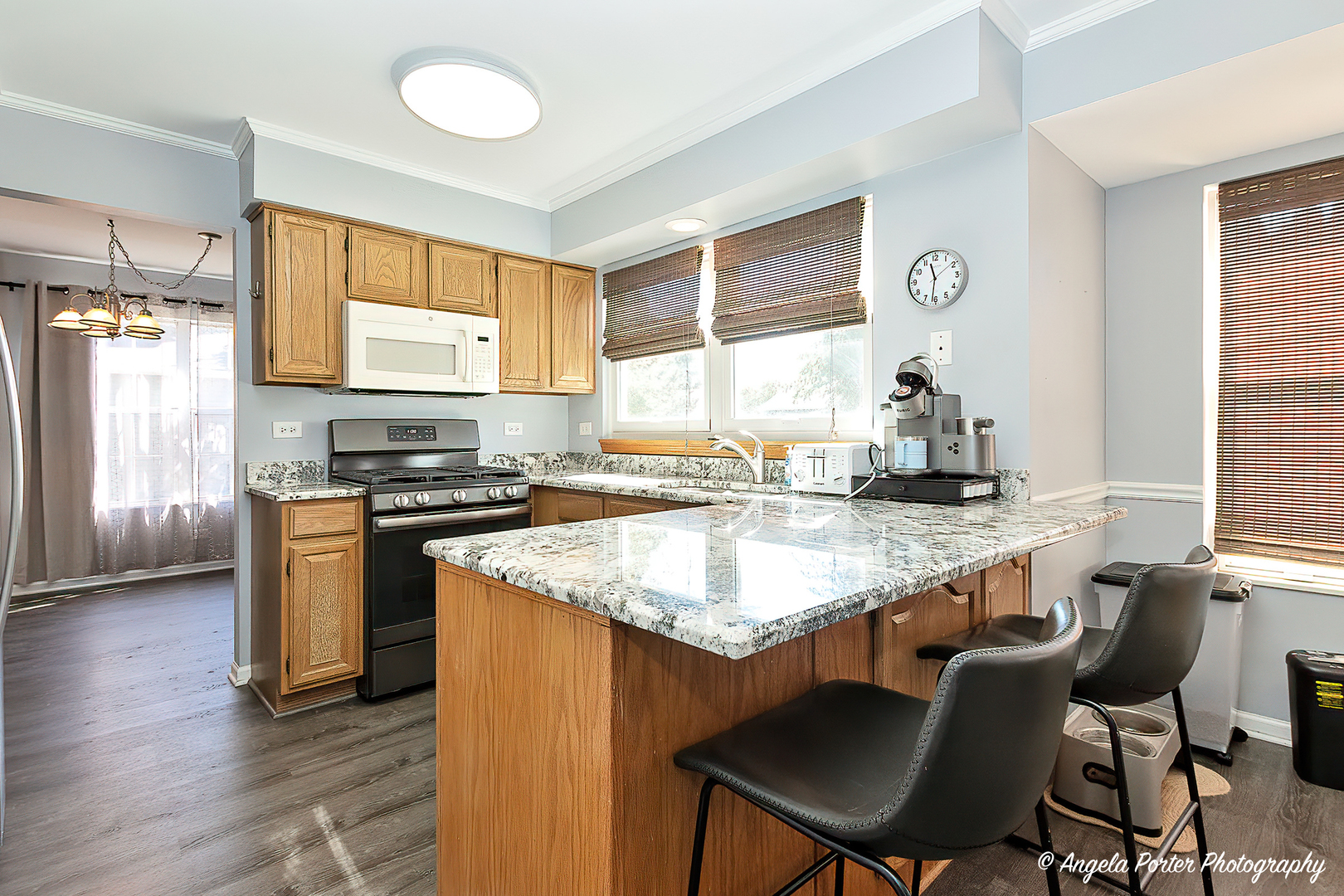 337 Claire Lane Cary, IL 60013 - Photo 4 of 35 a kitchen with a stove a sink and a refrigerator