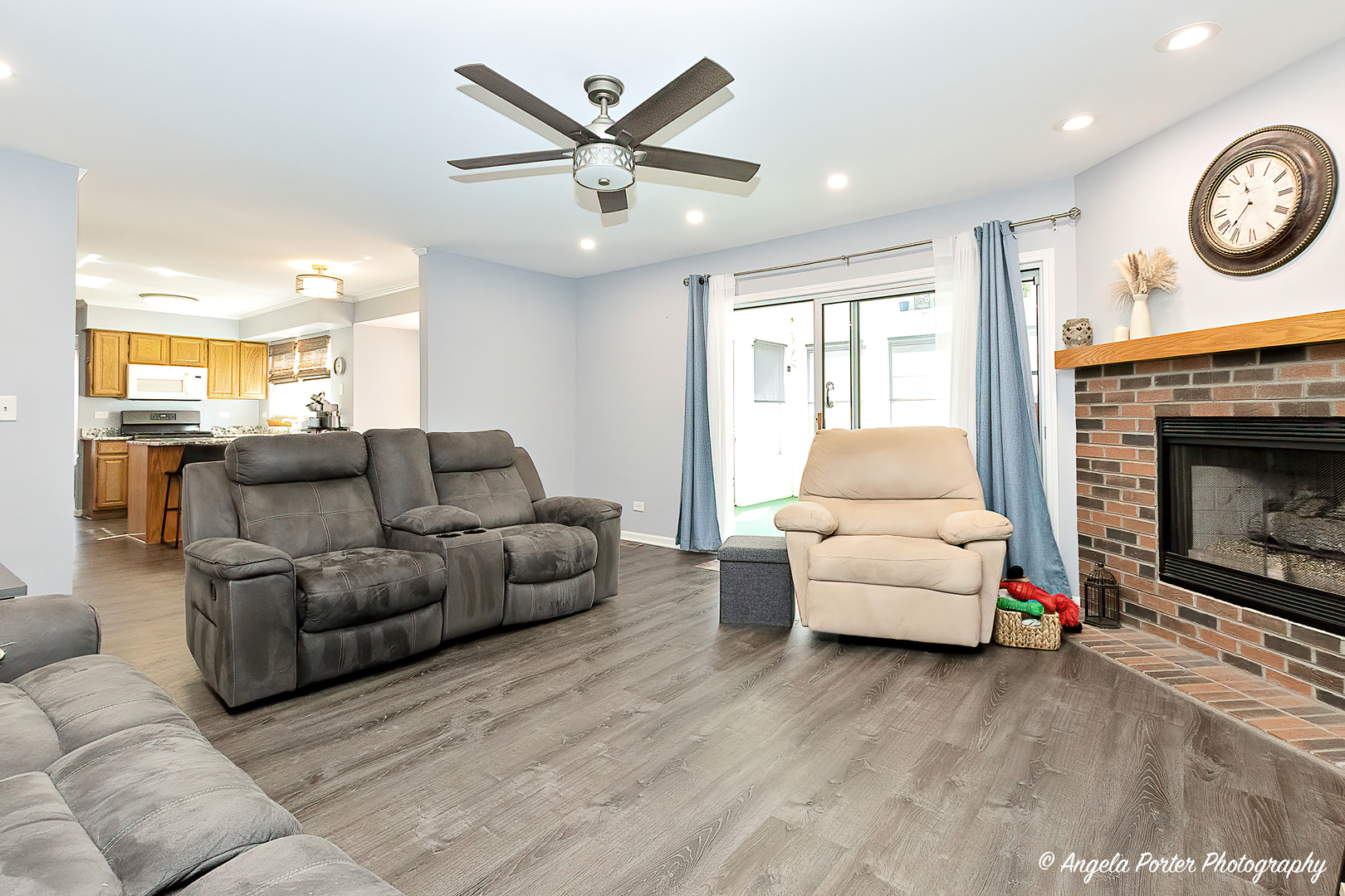 337 Claire Lane Cary, IL 60013 - Photo 10 of 35 a living room with furniture and a fireplace