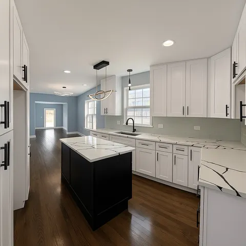 a kitchen with granite countertop a sink window and cabinets