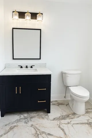a bathroom with a toilet a sink and mirror