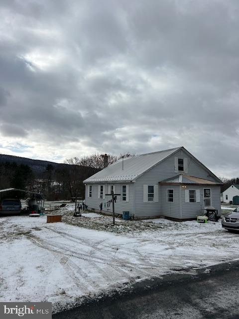 30 New Lancaster Valley Road Milroy, PA 17063 - Photo 2 of 2 Charming home nestled in a snowy landscape.