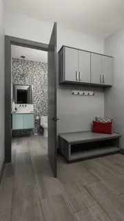 a view of kitchen with cabinets and window