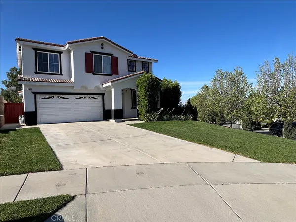 a front view of a house with yard