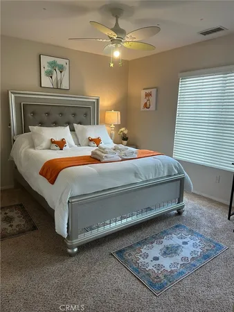a view of a building with that has a bed and a tv