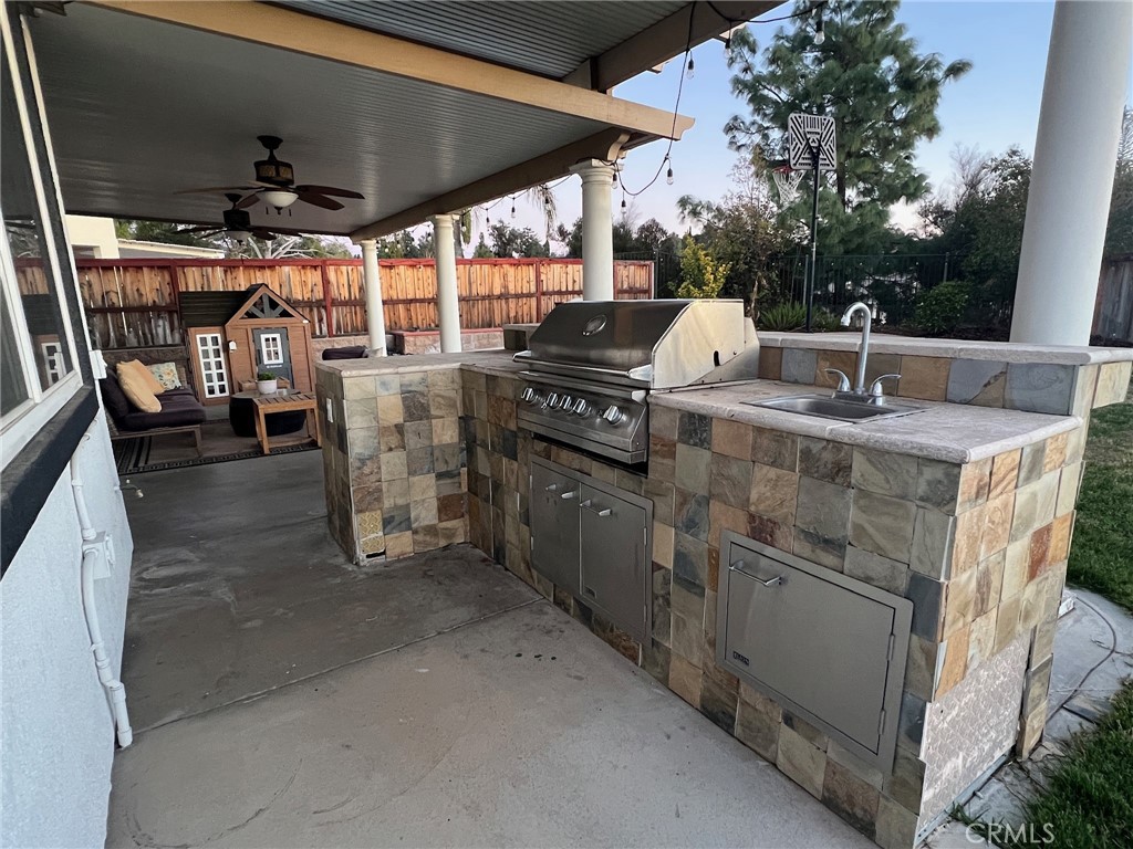 11617 Harvard Way Yucaipa, CA 92399 - Photo 52 of 58 a view of a kitchen with a sink and dishwasher