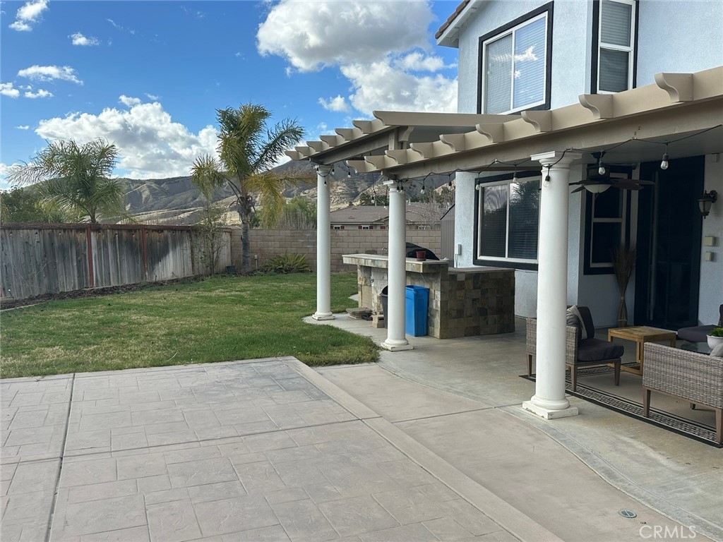 11617 Harvard Way Yucaipa, CA 92399 - Photo 53 of 58 a view of a house with a yard and sitting area