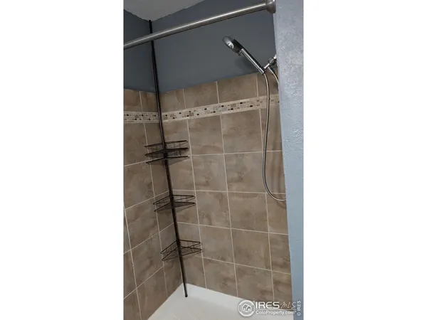 a bathroom with a glass shower door