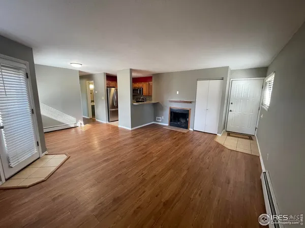 a view of a livingroom with wooden floor