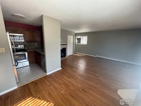 a view of a kitchen from the hallway