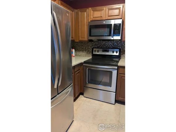 a kitchen with a stove and a microwave