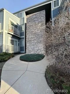 a view of a brick house with many windows