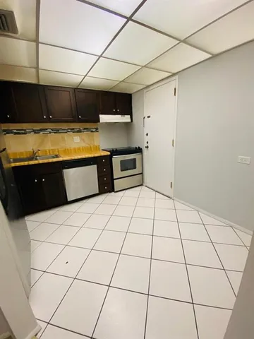 a kitchen with stainless steel appliances lots of counter top space