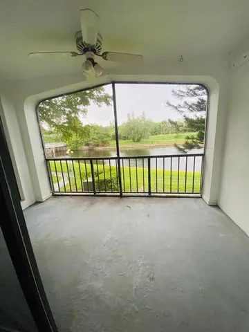 a view of a porch with a floor to ceiling window
