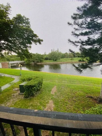 a view of a lake with a big yard