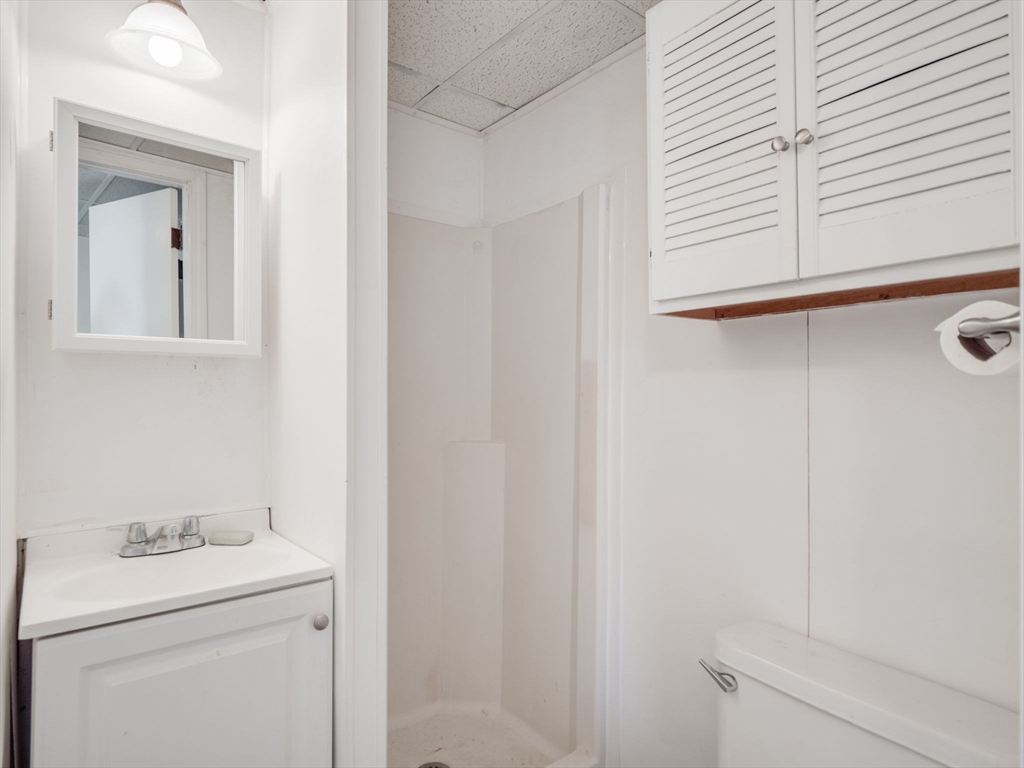 23 Lowell Street, Unit 2R Methuen, MA 01844 - Photo 5 of 5 a bathroom with a sink and a vanity
