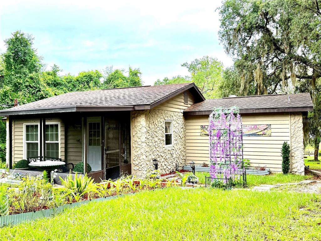 208 Ashley Street Hawthorne, FL 32640 - Photo 1 of 32 a front view of a house with a yard