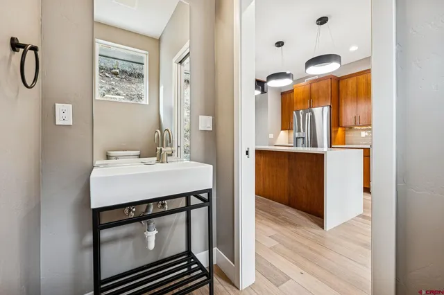 a bathroom with a sink vanity and mirror