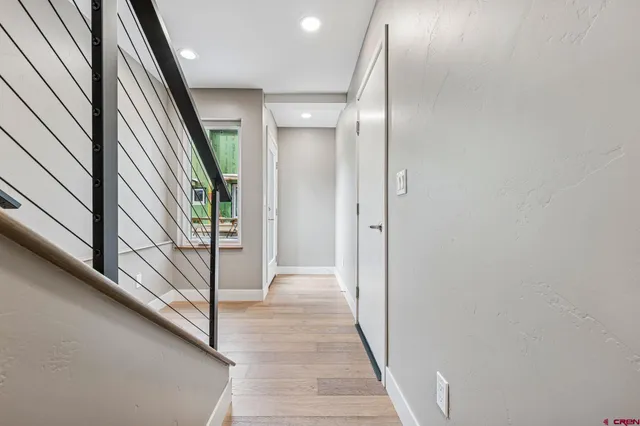 a view of a hallway with staircase
