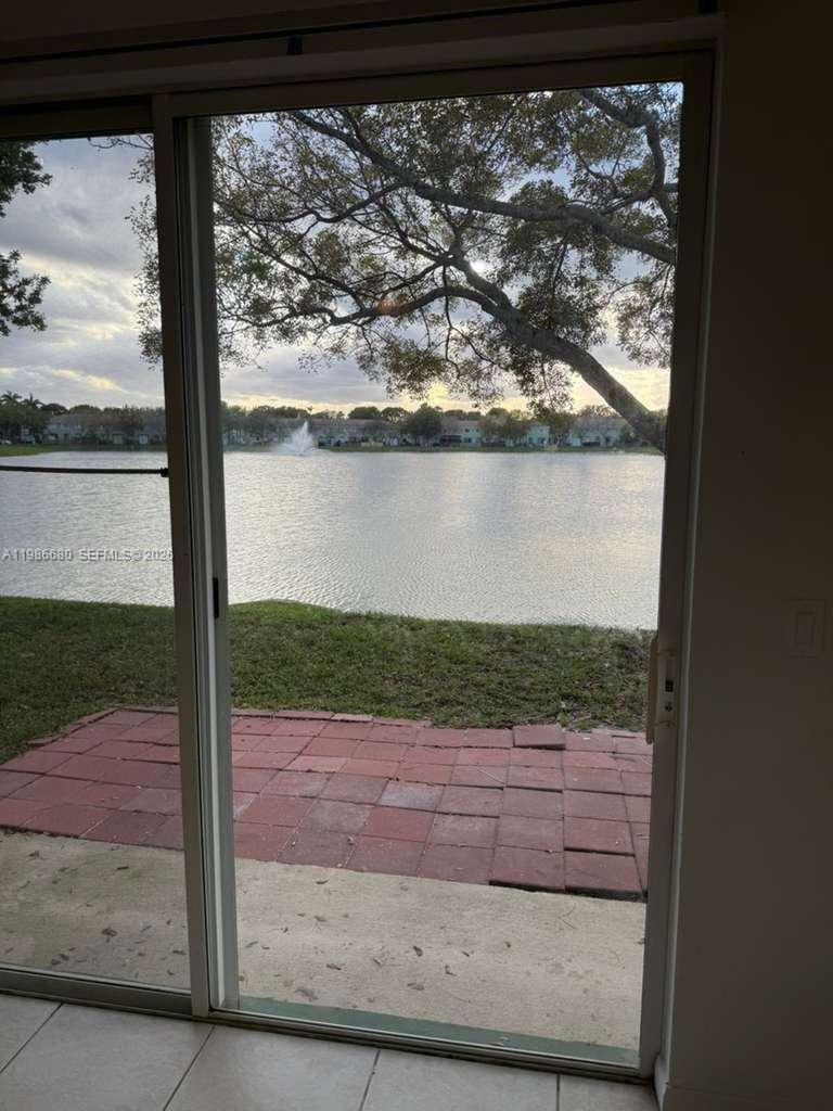 2470 Southeast 15th Place, Unit 335 Homestead, FL 33035 - Photo 1 of 33 a view of a yard with wooden fence