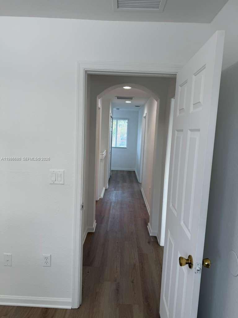 2470 Southeast 15th Place, Unit 335 Homestead, FL 33035 - Photo 13 of 33 wooden floor in a gallery