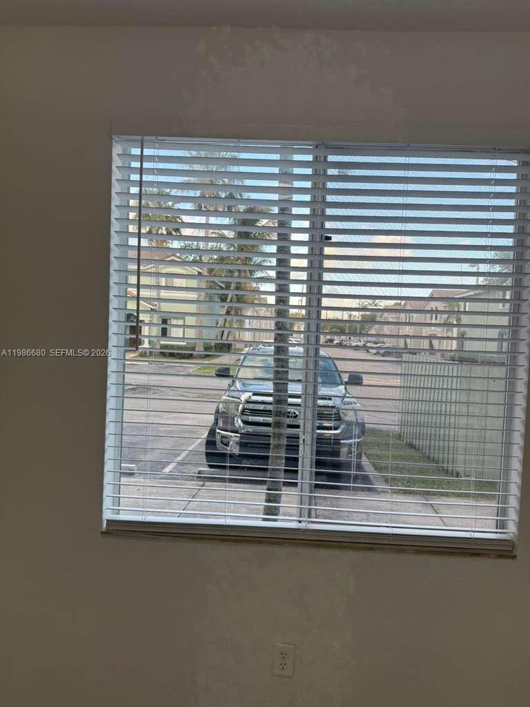2470 Southeast 15th Place, Unit 335 Homestead, FL 33035 - Photo 22 of 33 a view of a window and floor to ceiling window