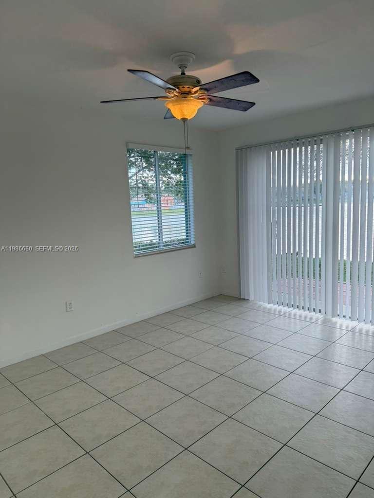 2470 Southeast 15th Place, Unit 335 Homestead, FL 33035 - Photo 4 of 33 a view of an empty room and window