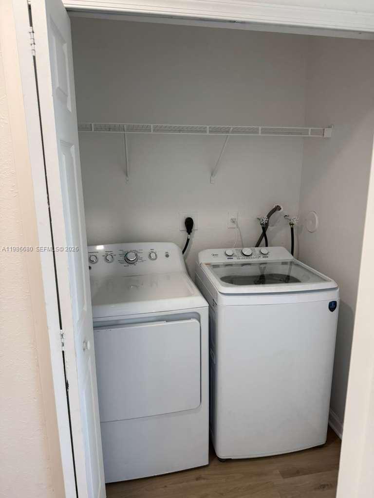 2470 Southeast 15th Place, Unit 335 Homestead, FL 33035 - Photo 8 of 33 a utility room with dryer and washer