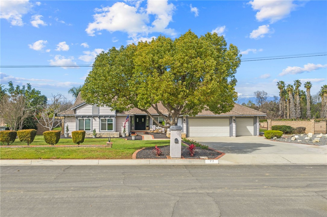 10717 Cleveland Avenue Riverside, CA 92503 - Photo 1 of 1 Curb appeal shines with a spacious front lawn, mature shade tree, and clean-lined façade with an oversized driveway.