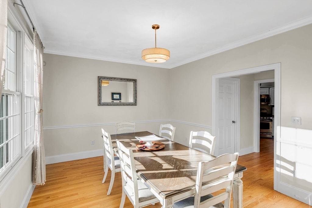 53 Emily Lane Rowley, MA 01969 - Photo 12 of 42 a view of a dining room with a table and chairs